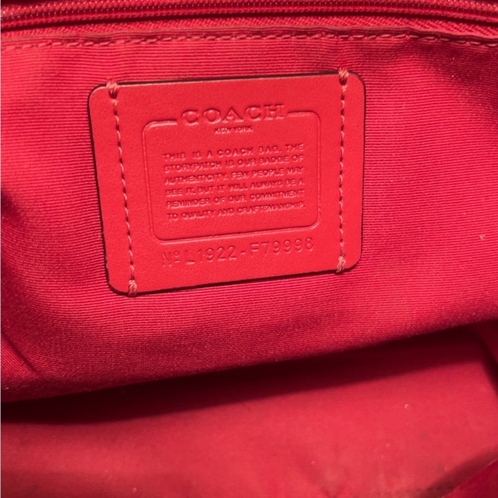 Coach prairie satchel. Brown canvas with gold hardware,red handles and straps.